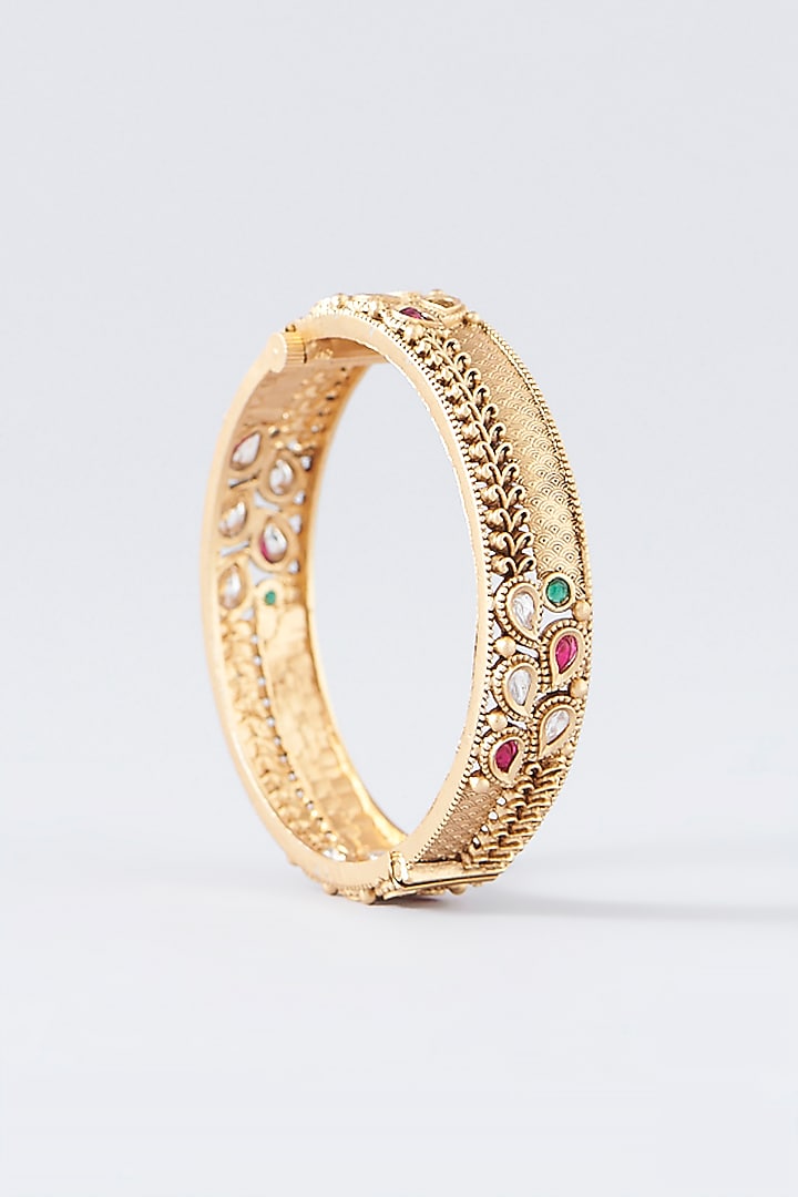 Gold Finish Kundan Polki & Multi-Colored Stone Temple Bangles (Set Of 2) by VASTRAA Jewellery at Pernia's Pop Up Shop