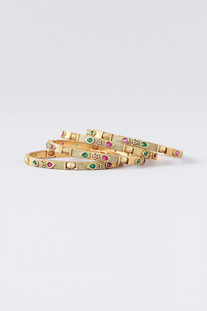 Gold Finish Kundan Polki & Multi-Colored Stone Temple Bangles (Set Of 4) by VASTRAA Jewellery at Pernia's Pop Up Shop