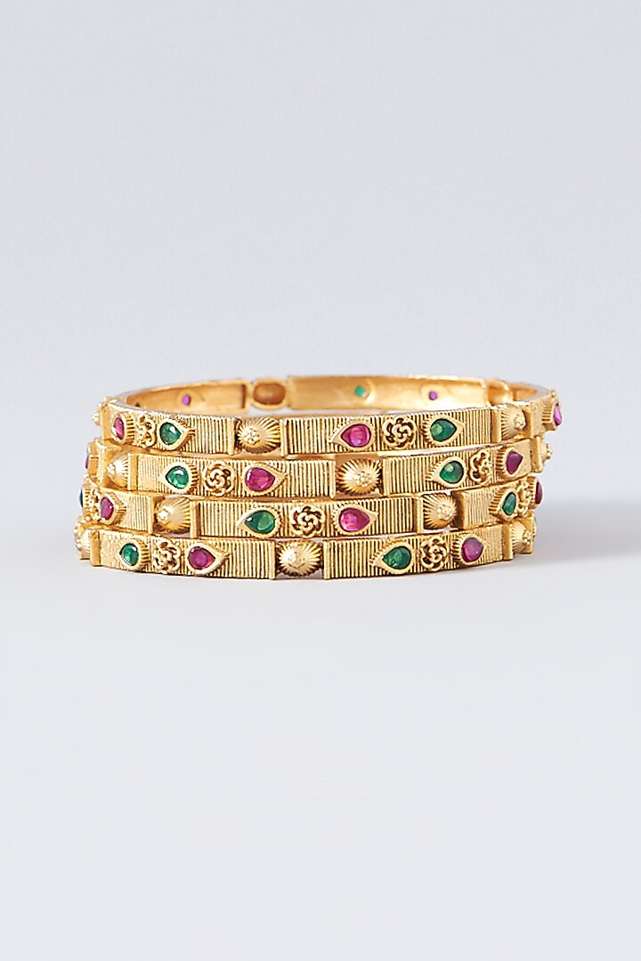 Gold Finish Kundan Polki & Multi-Colored Stone Temple Bangles (Set Of 4) by VASTRAA Jewellery at Pernia's Pop Up Shop