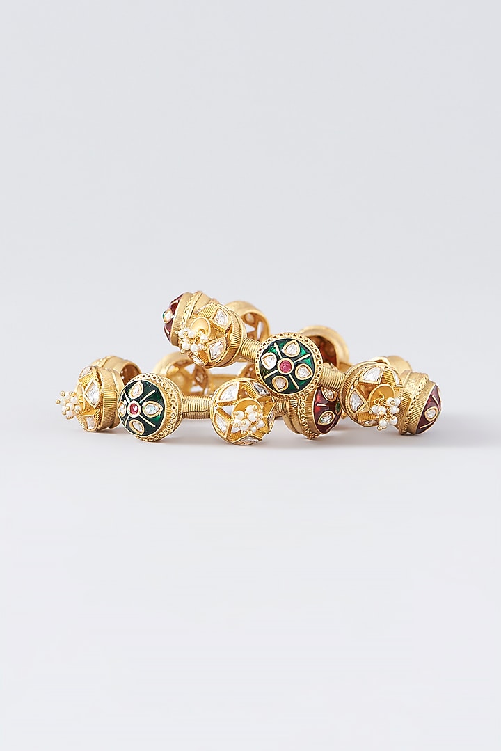 Gold Finish Kundan Polki & Multi-Colored Stone Temple Bangles (Set Of 2) by VASTRAA Jewellery at Pernia's Pop Up Shop