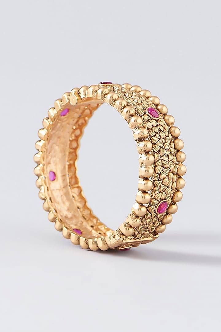 Gold Finish Kundan Polki & Red Stone Bangles (Set Of 2) by VASTRAA Jewellery at Pernia's Pop Up Shop