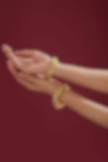 Gold Finish Kundan Polki & Red Stone Bangles (Set Of 2) by VASTRAA Jewellery at Pernia's Pop Up Shop