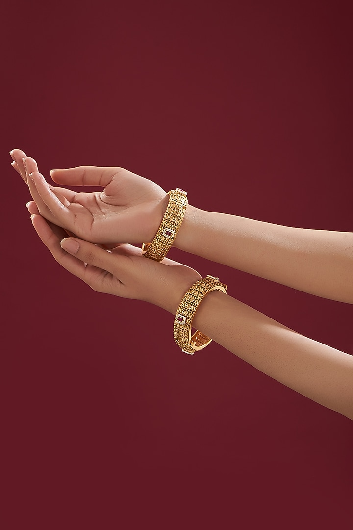 Gold Finish Kundan Polki & Red Stone Bangles (Set Of 2) by VASTRAA Jewellery at Pernia's Pop Up Shop
