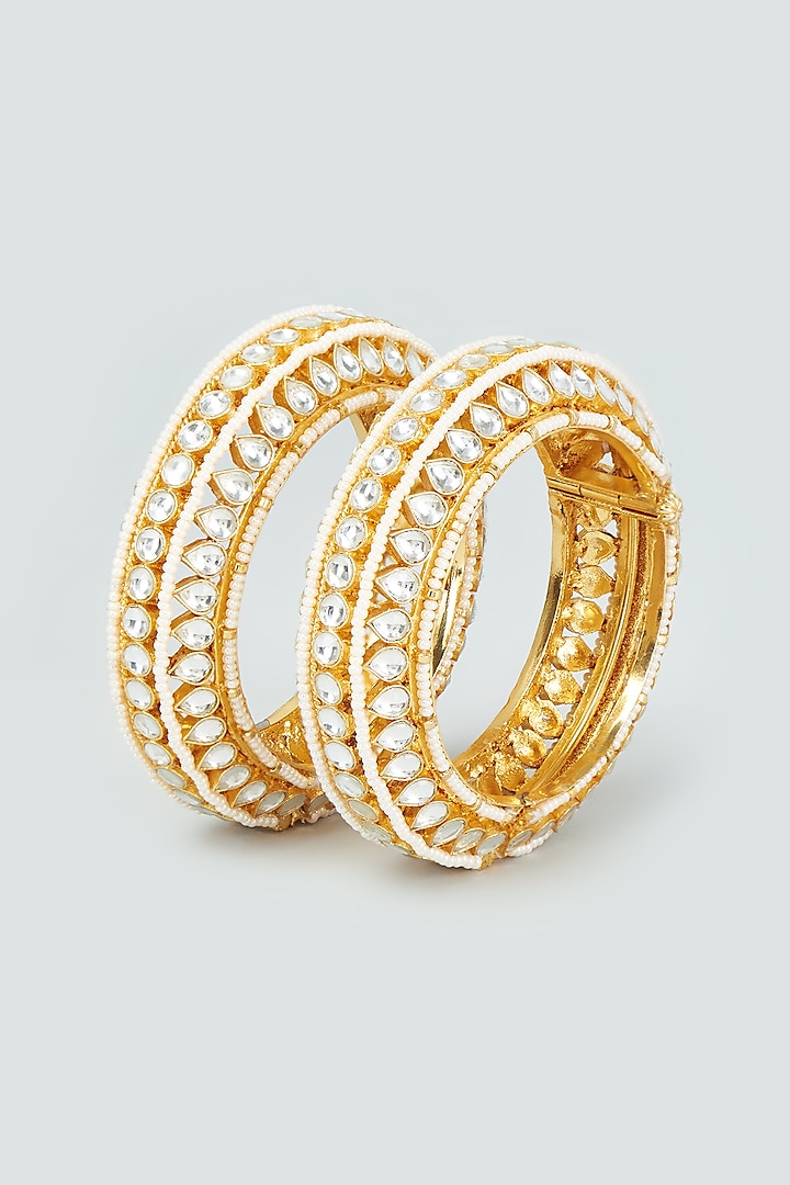 Gold Finish Kundan Polki & Pearl Bangles (Set of 2) by VASTRAA Jewellery at Pernia's Pop Up Shop