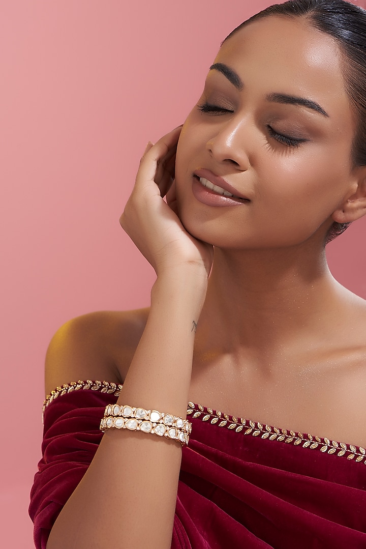 Gold Finish Kundan Polki Bangles (Set Of 2) by VASTRAA Jewellery at Pernia's Pop Up Shop