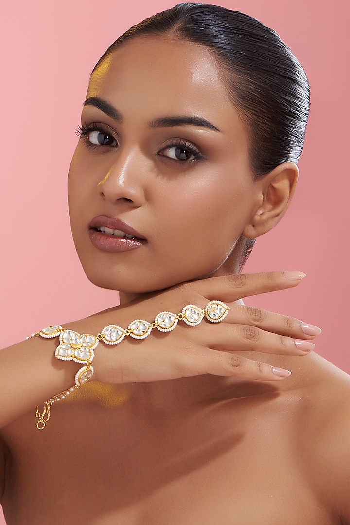 Gold Finish Kundan Polki & Pearl Haath Phool by VASTRAA Jewellery at Pernia's Pop Up Shop