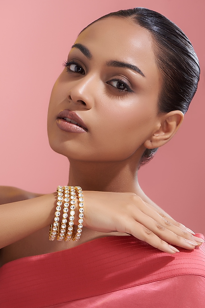 Gold Finish Kundan Polki Bangles (Set of 4) by VASTRAA Jewellery at Pernia's Pop Up Shop