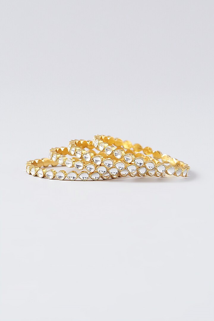 Gold Finish Kundan Polki Bangles (Set of 4) by VASTRAA Jewellery at Pernia's Pop Up Shop