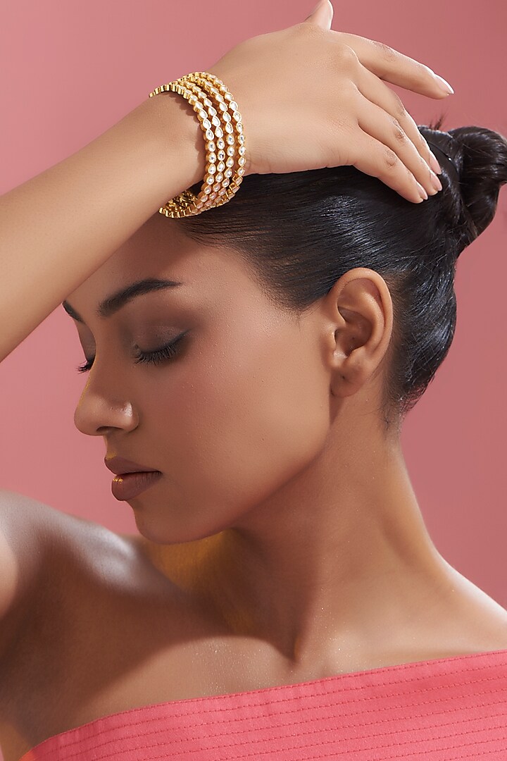 Gold Finish Kundan Polki Bangles (Set of 4) by VASTRAA Jewellery at Pernia's Pop Up Shop