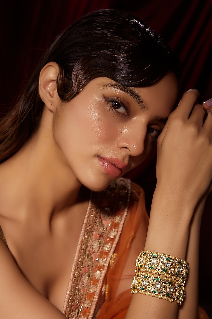 Gold Finish Kundan Polki & Green Stone Bangles (Set Of 2) by VASTRAA Jewellery at Pernia's Pop Up Shop