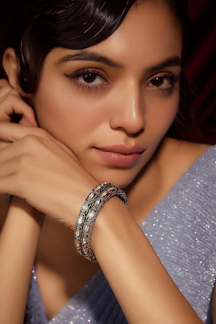Two-Tone Finish Kundan Polki Bangles (Set Of 2) by VASTRAA Jewellery at Pernia's Pop Up Shop