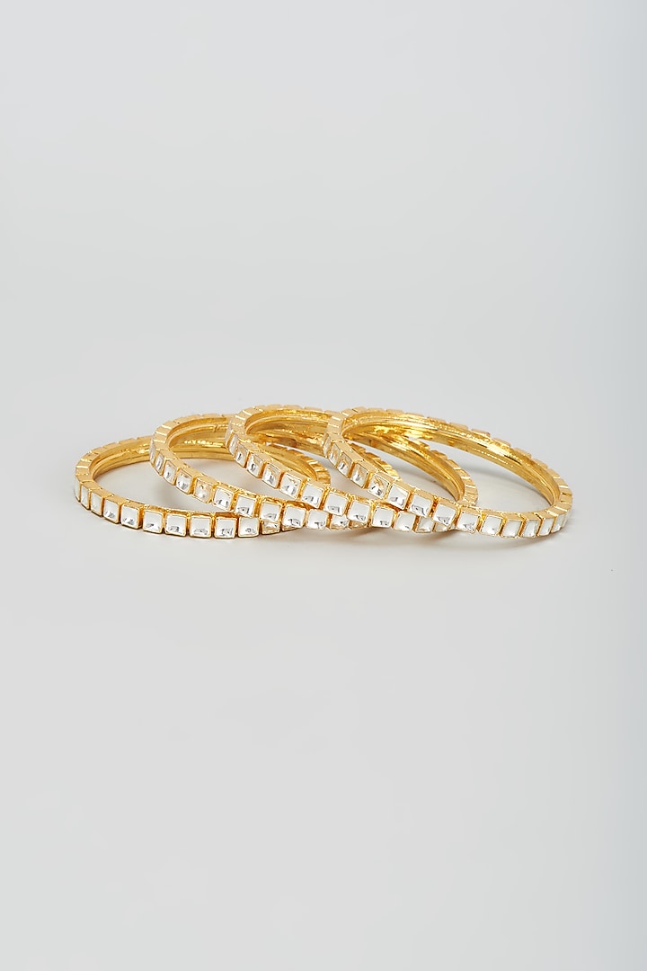 Gold Finish Kundan Polki Bangles (Set Of 4) by VASTRAA Jewellery at Pernia's Pop Up Shop