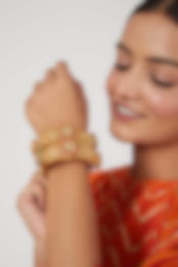 Gold Finish Red & Green Synthetic Stone Bangles (Set of 2) by VASTRAA Jewellery at Pernia's Pop Up Shop