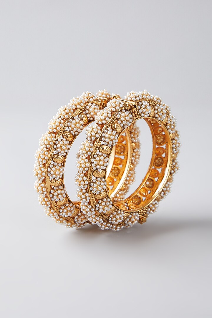 Gold Finish Pearl Bangles (Set Of 2) by VASTRAA Jewellery at Pernia's Pop Up Shop