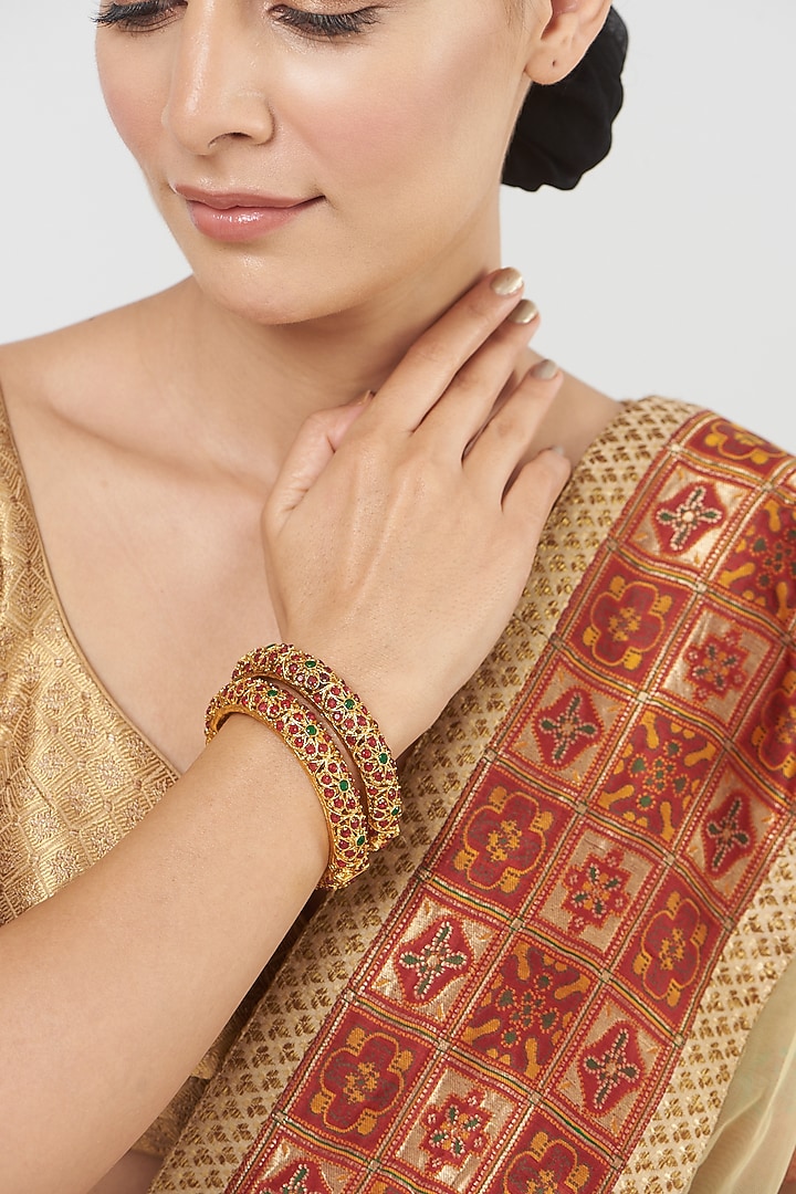 Gold Finish Red & Green Synthetic Stone Bangles (Set Of 2) by VASTRAA Jewellery at Pernia's Pop Up Shop