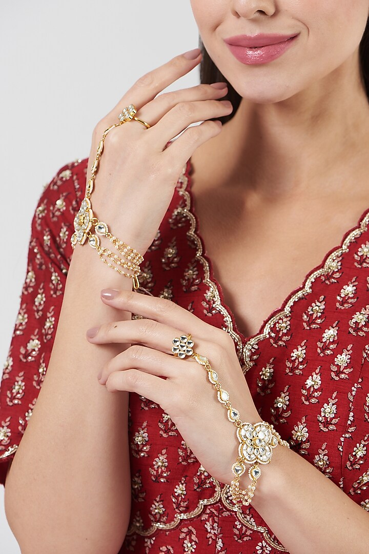 Gold Finish Kundan Polki Hathphool (Set Of 2) by VASTRAA Jewellery at Pernia's Pop Up Shop