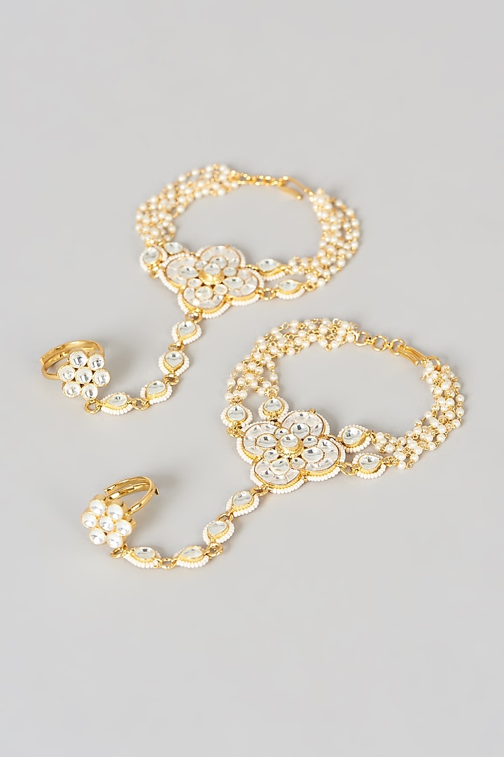 Gold Finish Kundan Polki Hathphool (Set Of 2) by VASTRAA Jewellery at Pernia's Pop Up Shop