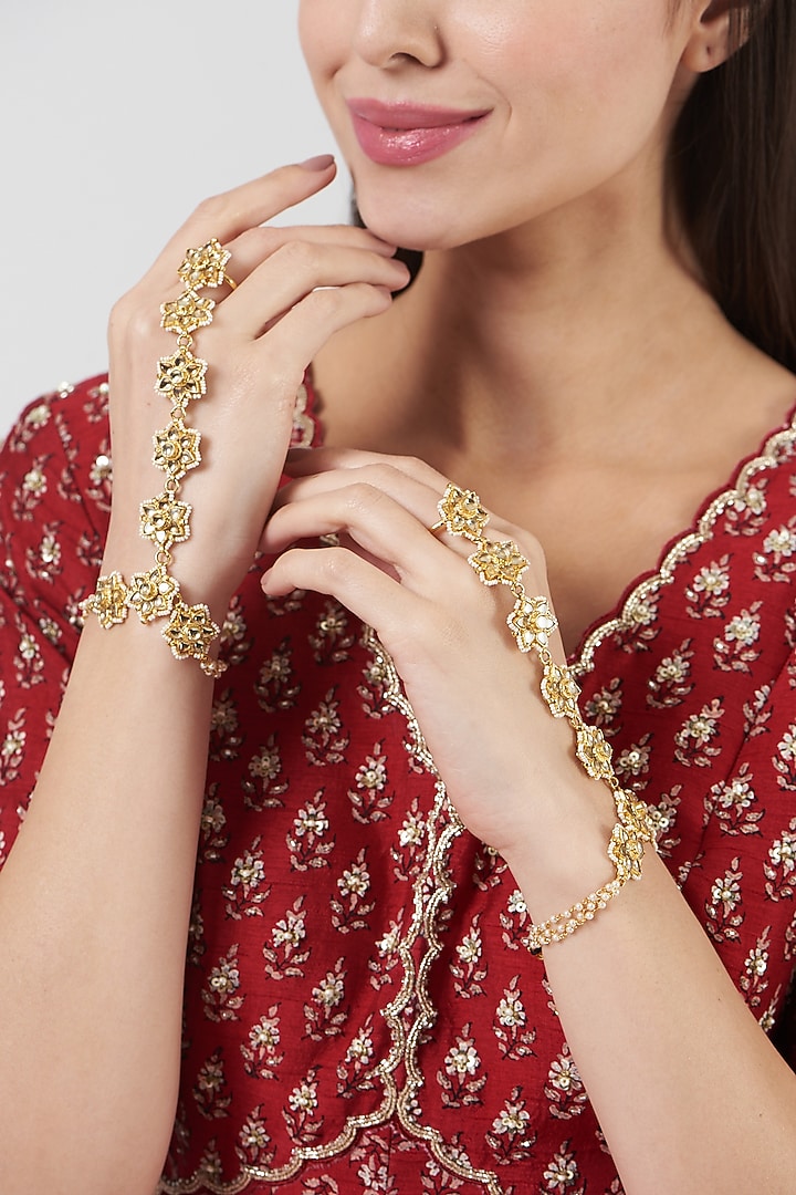 Gold Finish Kundan Polki Hathphool (Set Of 2) by VASTRAA Jewellery at Pernia's Pop Up Shop