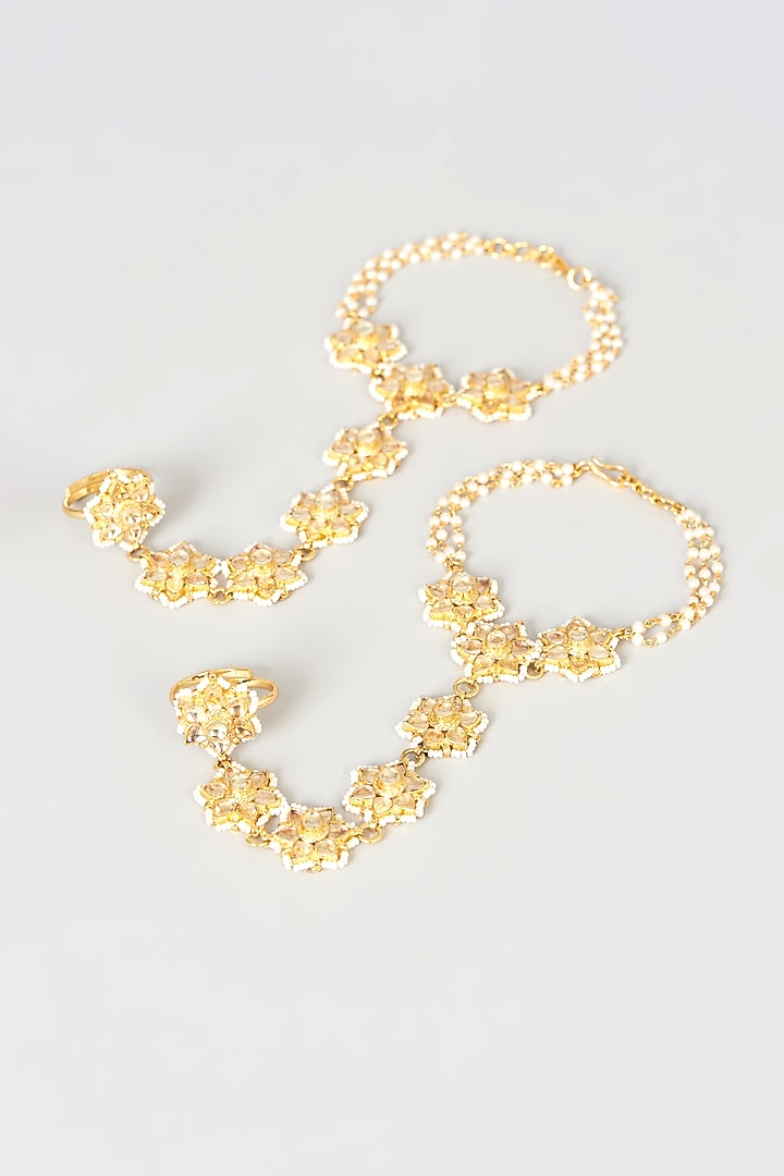 Gold Finish Kundan Polki Hathphool (Set Of 2) by VASTRAA Jewellery at Pernia's Pop Up Shop