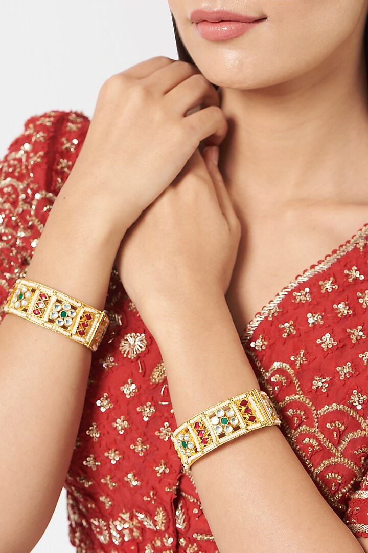 Gold Finish Kundan Polki & Multi-Colored Stone Bangles (Set Of 2) by VASTRAA Jewellery at Pernia's Pop Up Shop