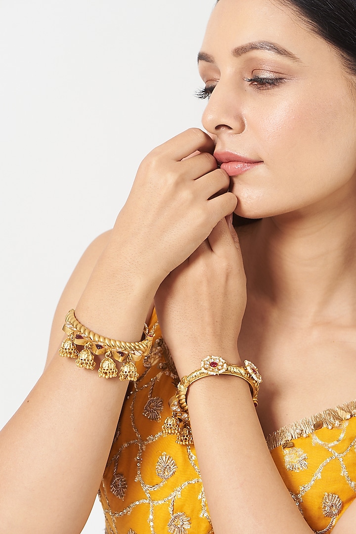 Gold Finish Kundan Polki & Red Stone Bangles (Set Of 2) by VASTRAA Jewellery at Pernia's Pop Up Shop