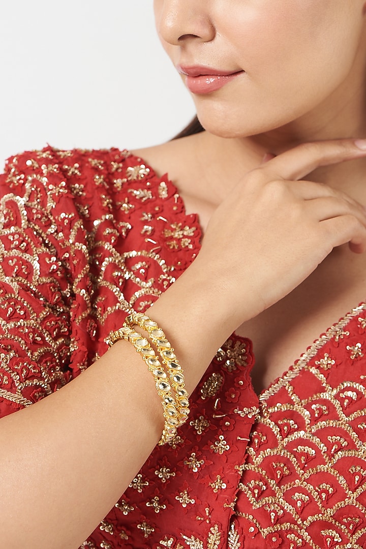 Gold Finish Kundan Polki Bangles (Set Of 2) by VASTRAA Jewellery at Pernia's Pop Up Shop