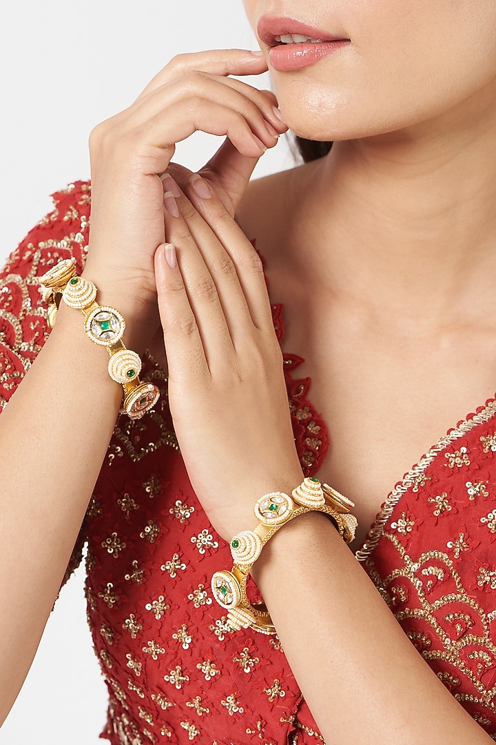 Gold Finish Green Stone & Kundan Polki Bangles (Set Of 2) by VASTRAA Jewellery at Pernia's Pop Up Shop