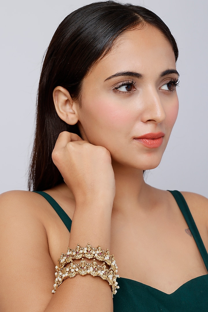 Gold Finish Pearl Temple Bangles (Set Of 2) by VASTRAA Jewellery at Pernia's Pop Up Shop