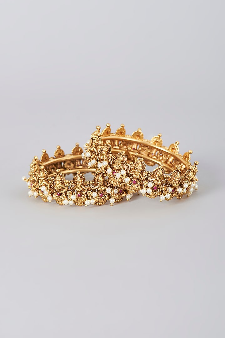 Gold Finish Pearl Temple Bangles (Set Of 2) by VASTRAA Jewellery at Pernia's Pop Up Shop