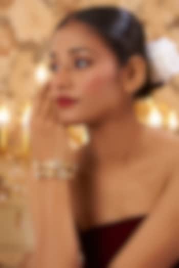 Gold Finish Kundan Polki Temple Bangles (Set Of 2) by VASTRAA Jewellery at Pernia's Pop Up Shop