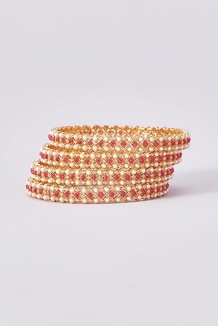 Gold Finish Kundan Polki Temple Bangles (Set Of 4) by VASTRAA Jewellery at Pernia's Pop Up Shop