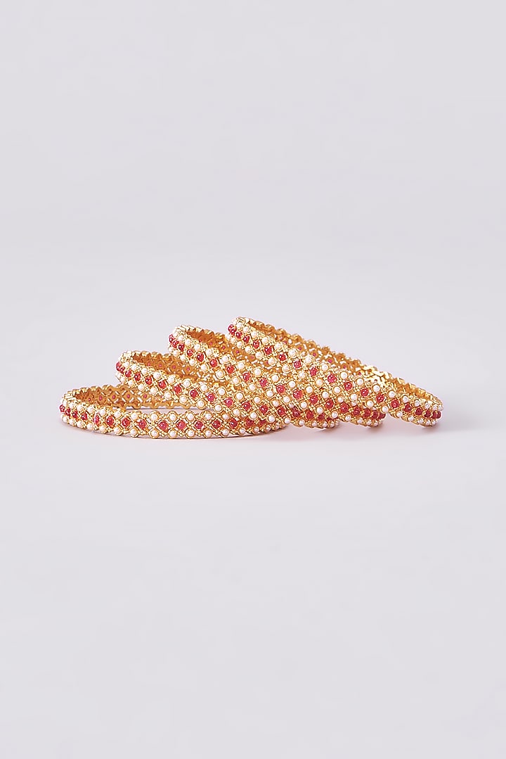 Gold Finish Kundan Polki Temple Bangles (Set Of 4) by VASTRAA Jewellery at Pernia's Pop Up Shop
