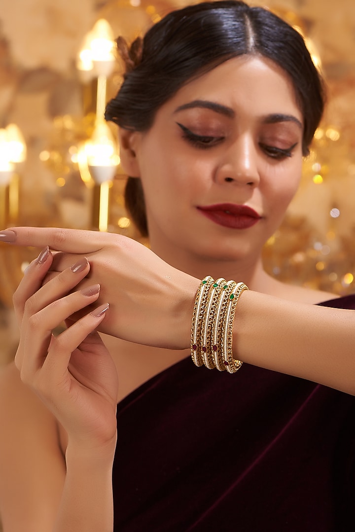 Gold Finish Kundan Polki Temple Bangles (Set Of 4) by VASTRAA Jewellery at Pernia's Pop Up Shop