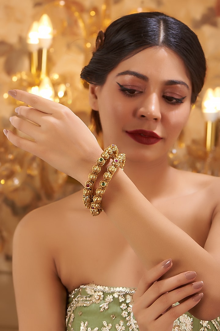 Gold Finish Kundan Polki Temple Bangles (Set Of 2) by VASTRAA Jewellery at Pernia's Pop Up Shop