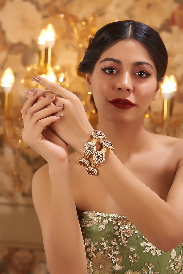 Gold Finish Kundan Polki Temple Bangles (Set Of 2) by VASTRAA Jewellery at Pernia's Pop Up Shop