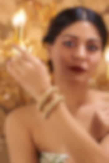 Gold Finish Kundan Polki Temple Bangles (Set Of 2) by VASTRAA Jewellery at Pernia's Pop Up Shop