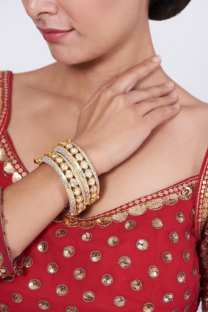 Gold Finish Kundan Polki Bangles (Set of 2) by VASTRAA Jewellery at Pernia's Pop Up Shop