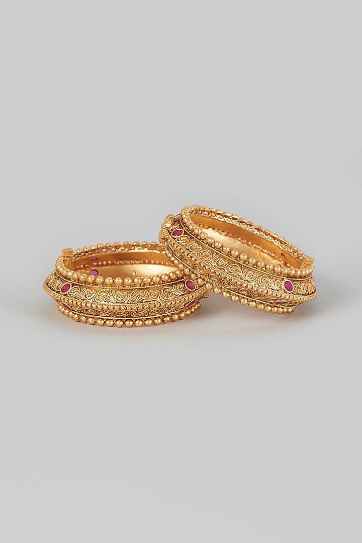 Gold Finish Red Stone Temple Bangles (Set of 2) by VASTRAA Jewellery at Pernia's Pop Up Shop