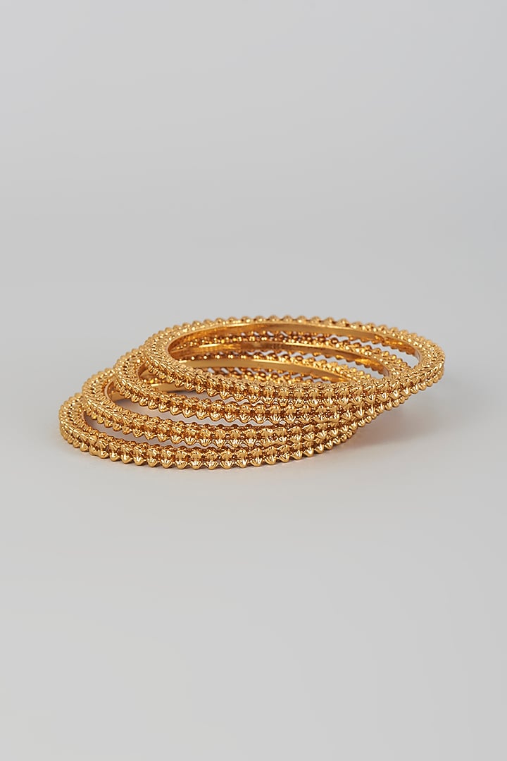 Gold Finish Kundan Polki Temple Bangles (Set Of 4) by VASTRAA Jewellery at Pernia's Pop Up Shop