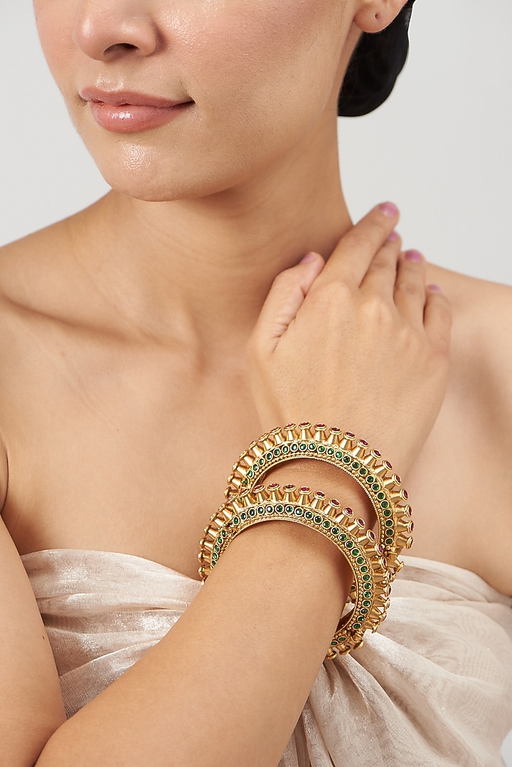Gold Finish Red & Green Synthetic Stone Temple Bangles (Set of 2) by VASTRAA Jewellery at Pernia's Pop Up Shop