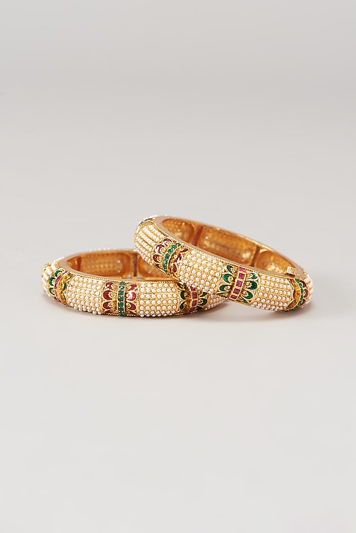 Gold Finish Pearl & Multi-Colored Stone Temple Bangles (Set of 2) by VASTRAA Jewellery at Pernia's Pop Up Shop