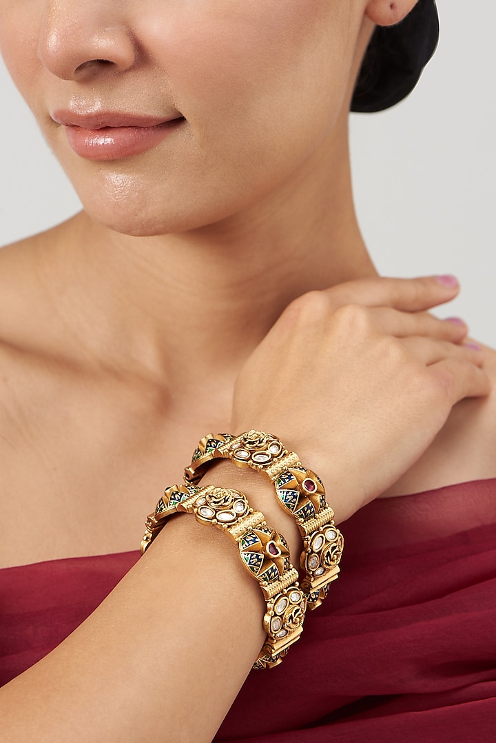 Gold Finish Kundan Polki & Red Stone Enameled Bangles (Set of 2) by VASTRAA Jewellery