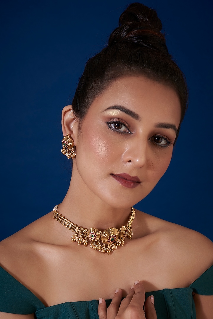Gold Finish Synthetic Green & Red Stone Temple Choker Necklace Set by VASTRAA Jewellery at Pernia's Pop Up Shop
