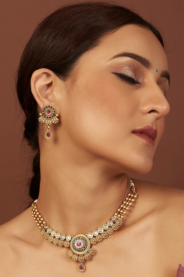 Gold Finish Synthetic Red & Green Stone Temple Necklace Set by VASTRAA Jewellery at Pernia's Pop Up Shop