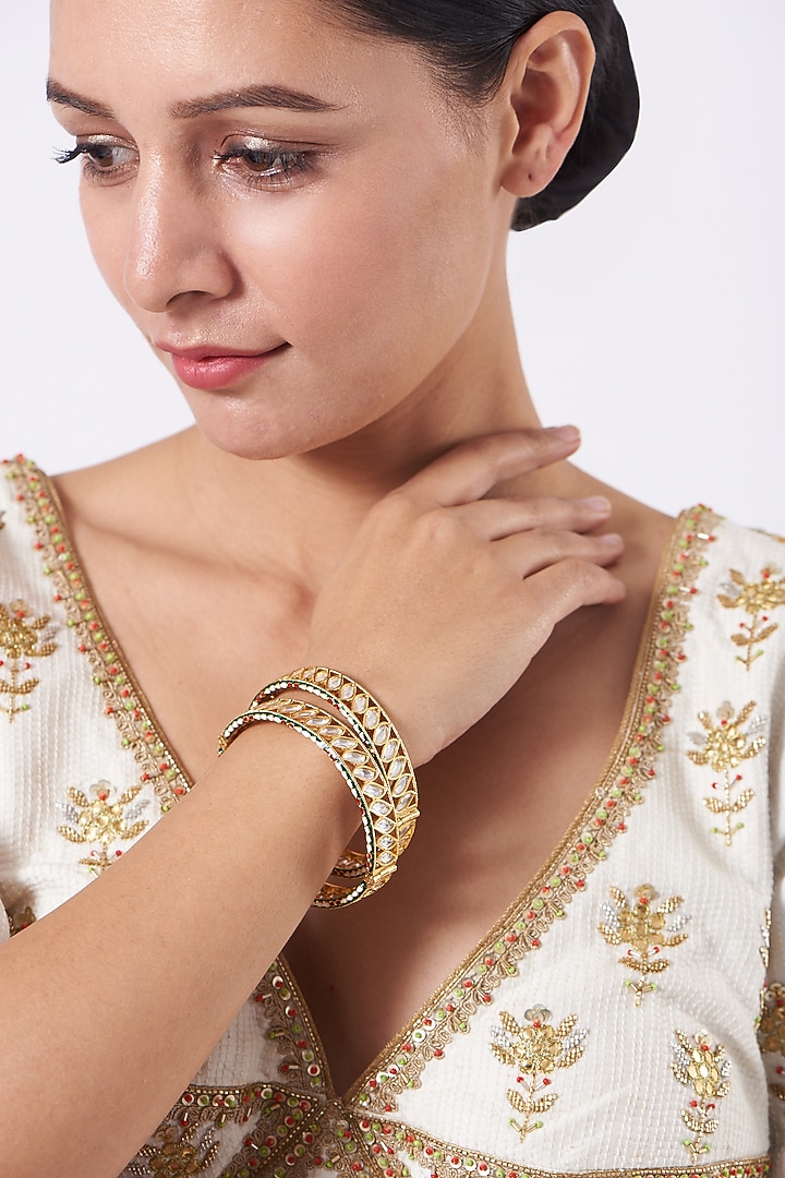 Gold Finish Kundan Polki & Green Stone Openable Bangles (Set of 2) by VASTRAA Jewellery at Pernia's Pop Up Shop