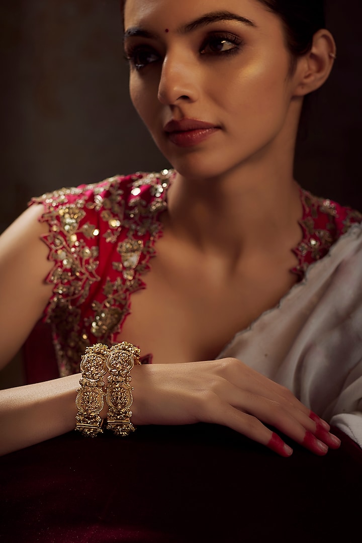 Gold Finish Kundan Polki Temple Bangles (Set of 2) by VASTRAA Jewellery at Pernia's Pop Up Shop