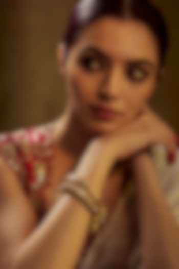 Gold Finish Kundan Polki & Multi-Colored Stone Temple Bangles (Set of 2) by VASTRAA Jewellery at Pernia's Pop Up Shop