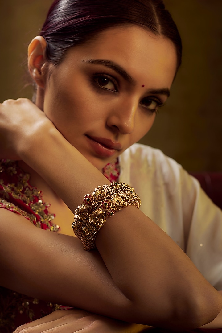 Gold Finish Kundan Polki & Multi-Colored Stone Temple Bangles (Set of 2) by VASTRAA Jewellery at Pernia's Pop Up Shop