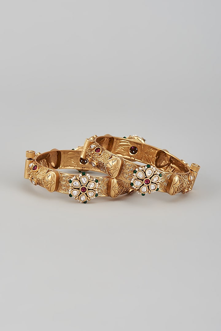 Gold Finish Kundan Polki & Multi-Colored Stone Temple Bangles (Set of 2) by VASTRAA Jewellery at Pernia's Pop Up Shop