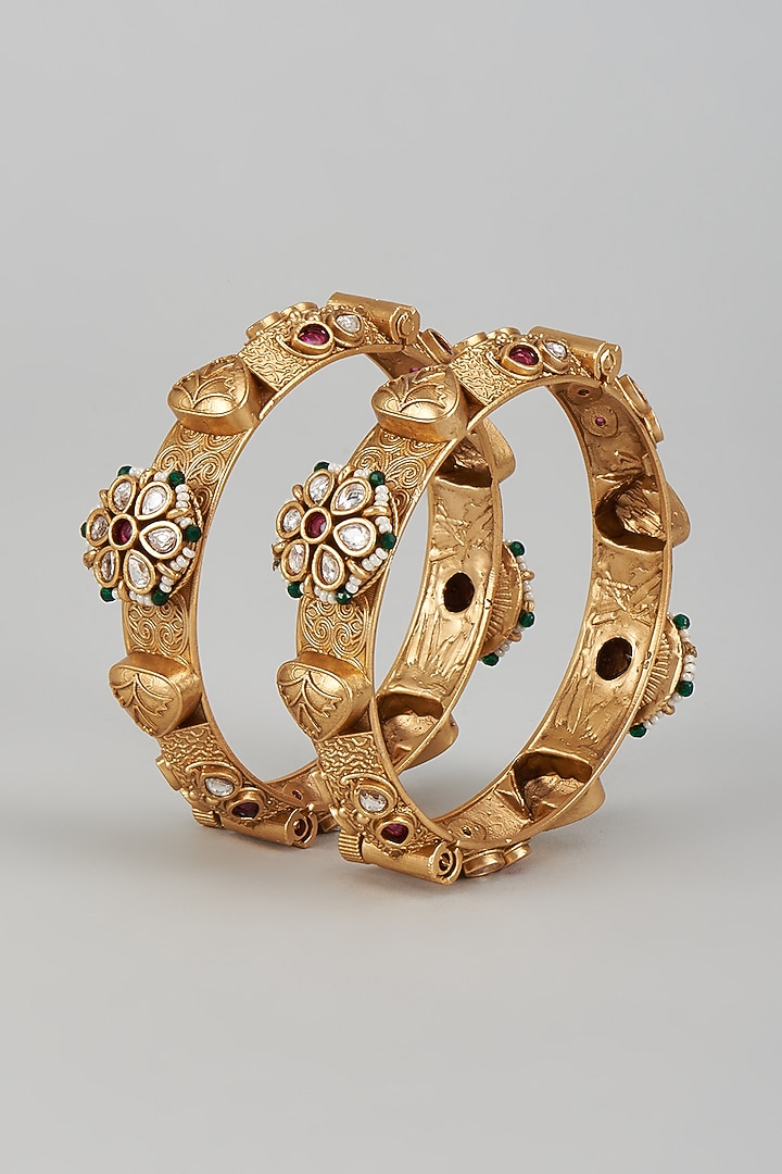 Gold Finish Kundan Polki & Multi-Colored Stone Temple Bangles (Set of 2) by VASTRAA Jewellery at Pernia's Pop Up Shop